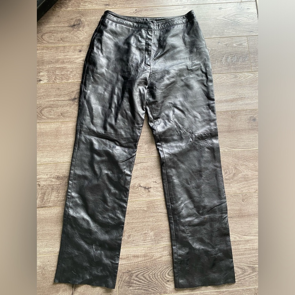 Danier genuine black leather pants. Trendy wide leg, high rise and raw hem